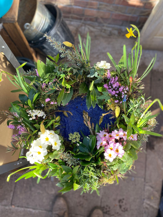 Floral wreath with greenery and flowers on a door